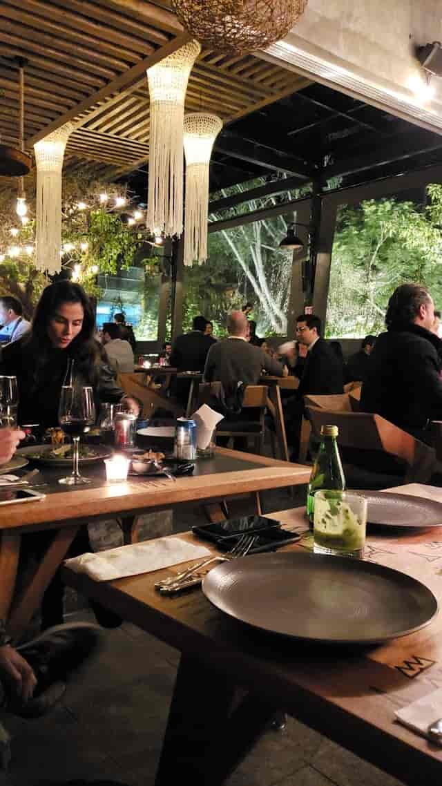 Fiera Rooftop corporate mixer with warm string lighting and chic furniture for networking events.