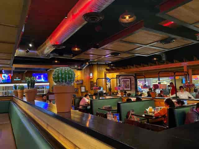 Rooftop restaurant with booth seating for corporate networking and post-conference happy hours.