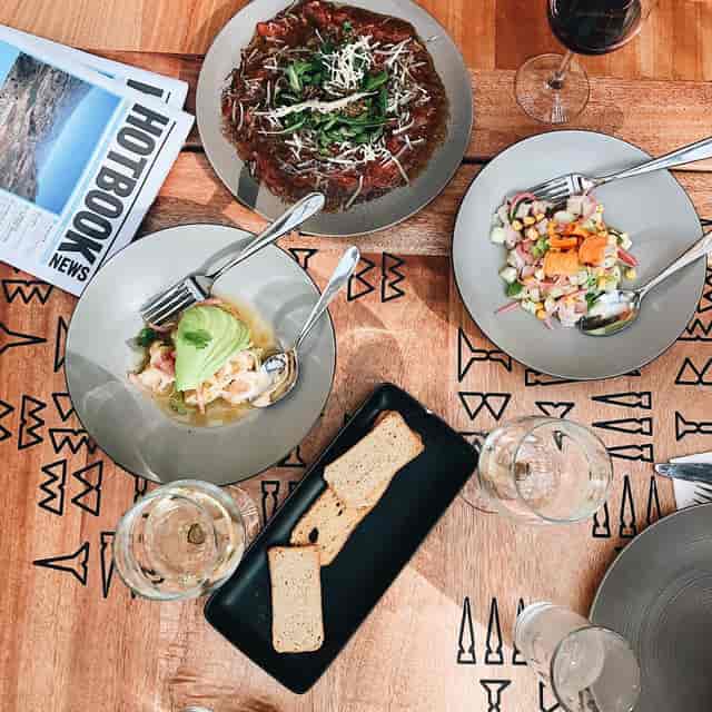 Fiera Rooftop networking lunch with elegant table settings and plated local cuisine.