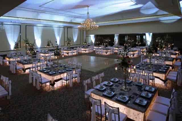 Le Crillon ballroom with square seating and dance floor for formal events and luxury social dining.
