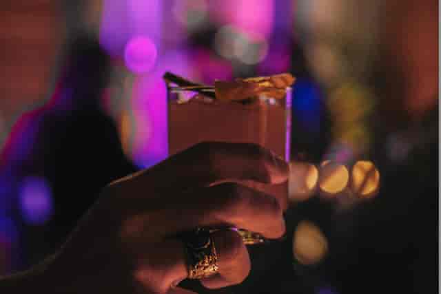 Rooftop lounge evening reception with mood lighting and cocktails for corporate events.