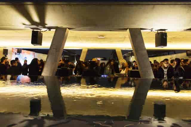 Modern rooftop event venue with reflective pool for networking and corporate receptions.