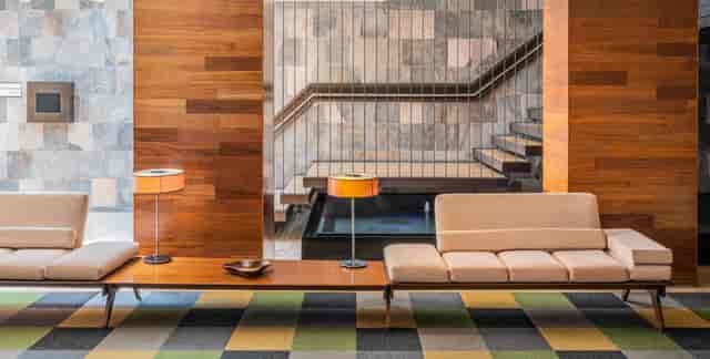 The Paragon Hotel breakout space with wood accents, ideal for executive meetings and networking.