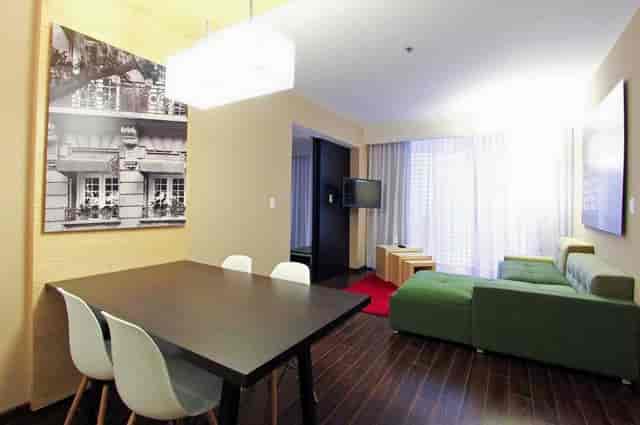 Fiesta Inn Insurgentes studio suite for executive meetings and corporate breakout sessions.