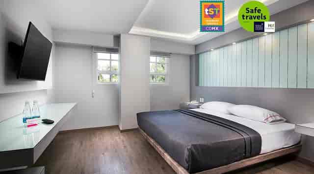 Modern hotel suite in Mexico City with workspace for business travel and event accommodation.
