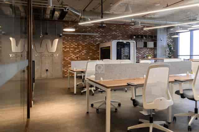 Modern private office with acoustic booth for coworking and professional workspace rental.