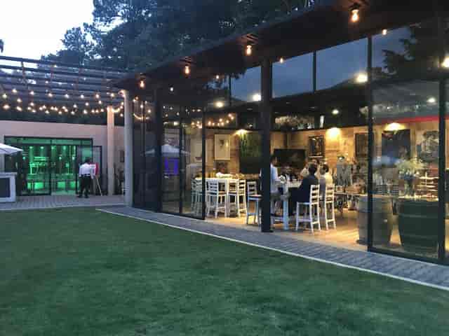 Vinícola del Bosque indoor-outdoor garden with bistro lighting for networking and gala events.