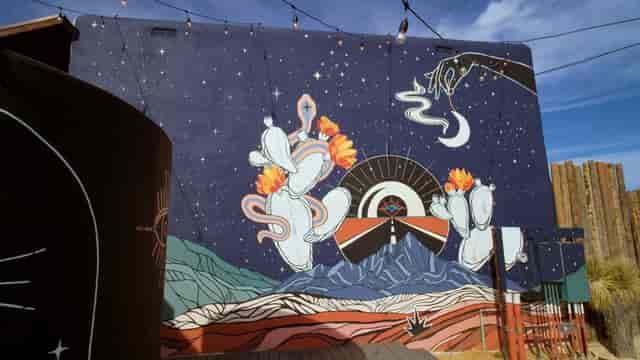 High Desert Hideaway mural with string lights for outdoor wedding reception or cocktail event.