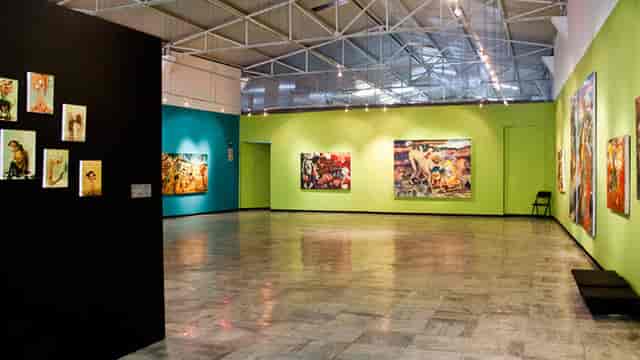 Industrial exhibition hall with track lighting for corporate events and product launches.