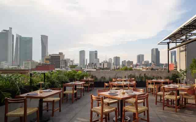 Open-air corporate reception venue at Maison Mexico Roma, ideal for networking events.