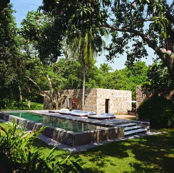 Maison Couturier poolside lounge for luxury corporate retreats and networking events.