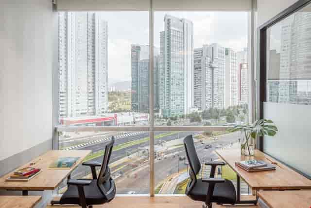 Minimalist office breakout room with urban views for VIP strategy meetings and corporate rental.