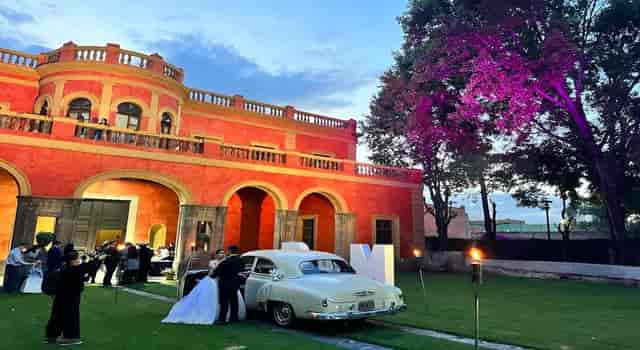 Ex Hacienda San Pablo wedding venue with vintage car for destination weddings and event photography.