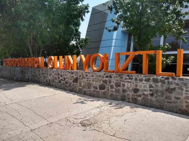 Hermilo Novelo Hall signage at Ollin Yoliztli Cultural Center for event wayfinding and venue access.