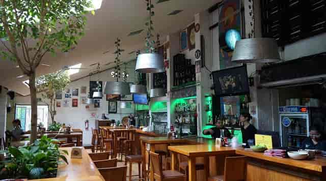 Bar & grill high-top seating for networking events and professional mixers at Centenario 107.