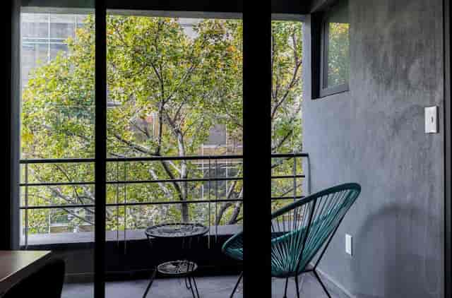 Chic 1BR condo balcony for networking or conference breakout space in Capitalia Condesa Escandon.