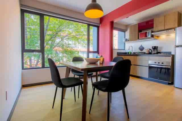 Co-working rooftop garden breakout space for small team meetings and corporate events.