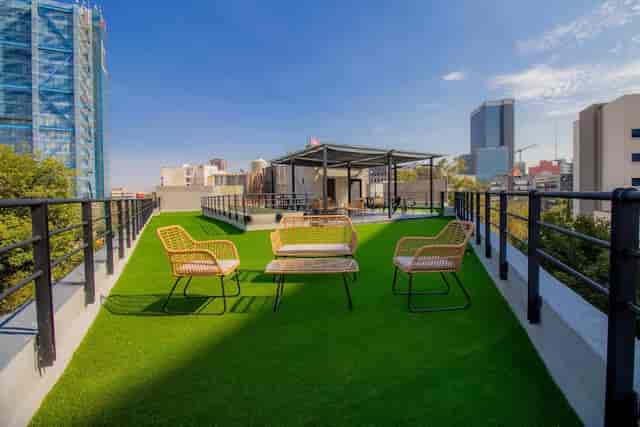 Rooftop garden breakout space for corporate retreats and cocktail events with skyline views.