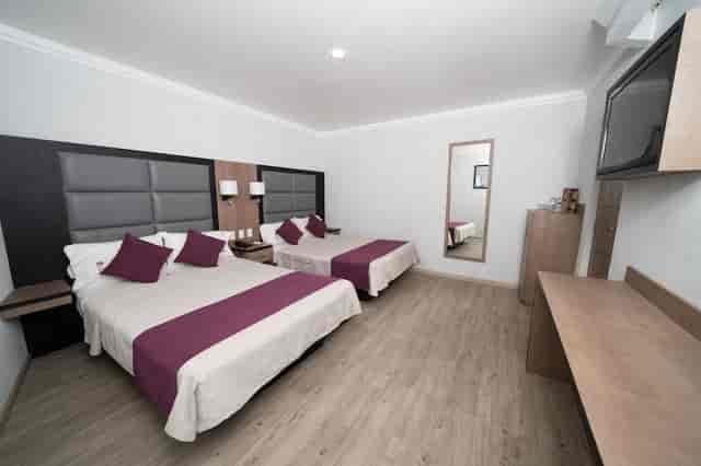 Double queen suite at Hotel Mónaco Mexico City for event lodging and business group travel.