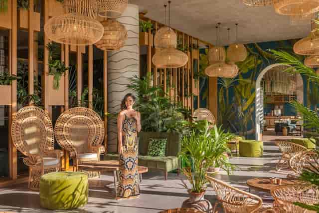 Gipsy Tent lounge with wicker decor, ideal for luxury corporate events and upscale receptions.