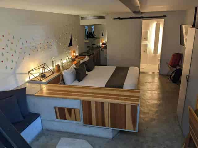 Hotel Carlota boutique room: industrial-chic design for urban incentive and business travel.