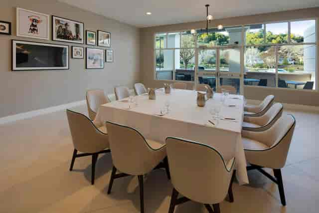 Boardroom setup with linen-draped tables at Red Oak Craft Bar for private dining and events.