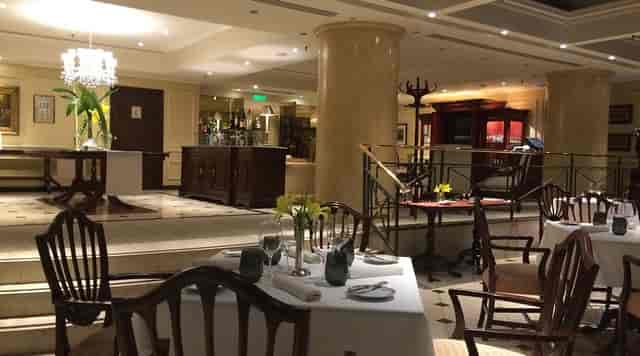 Upscale St. Regis private dining room with elegant table settings for board dinners and receptions.