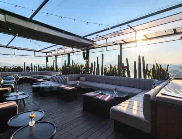 Rooftop lounge at La Caña with string lighting for high-end networking receptions and events.