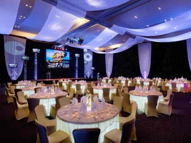 Avalon Ballroom with ceiling draping and stage trussing for corporate events and gala dinners.