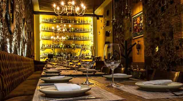 Limosneros Restaurante: sophisticated backlit bar for corporate dinners and VIP events.