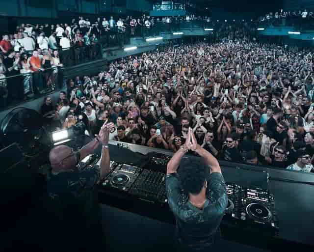 Sold-out live performance at UNVRS main floor with high-energy crowd, club event, concert venue.