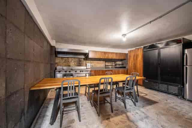 Industrial kitchen venue for team-building workshop and culinary events at Lucerna 32.
