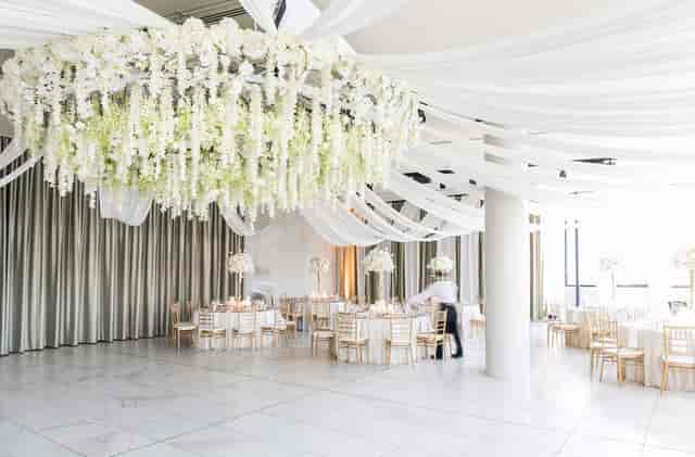Elegant event space with floral ceiling for formal reception and luxury wedding venue hire.