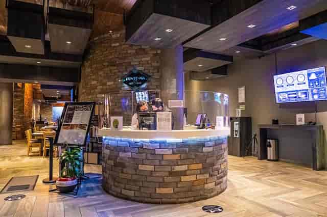 Modern registration desk with stone counter at Buffet MX for event planning and corporate hosting.