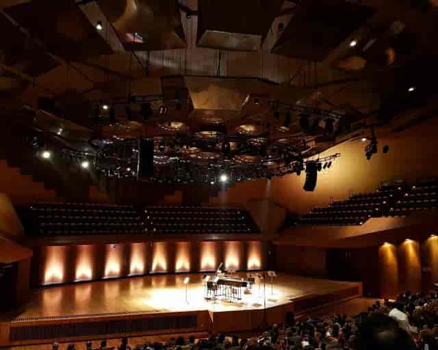Grand piano on stage in a professional auditorium for SIAM Mexico 2023 keynote or recital.