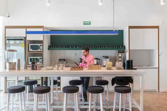 Modern Mitikah office pantry for corporate networking and business event rental space.