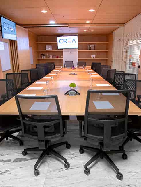 Boardroom meeting room with ergonomic seating for corporate business conferences.