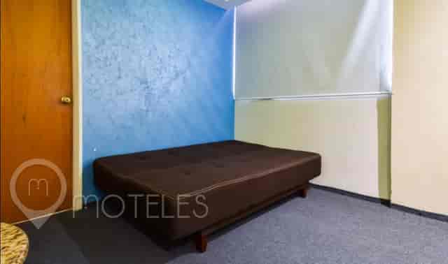Triple room at Hotel Siesta del Sur with non-traditional breakout space for informal meetings.