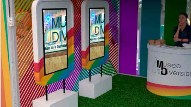 Trade show booth with digital kiosks and chevron graphics for brand engagement event workshop.
