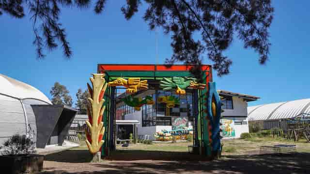 Vibrant arched entryway at Faro Tláhuac cultural center, ideal for event venue and photography.