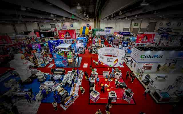Trade show floor at Citibanamex Center with hanging signage for exhibition hall event planning.