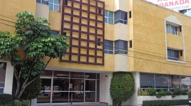 Budget-friendly Hotel Granada restaurant facade for corporate meetings and local events.