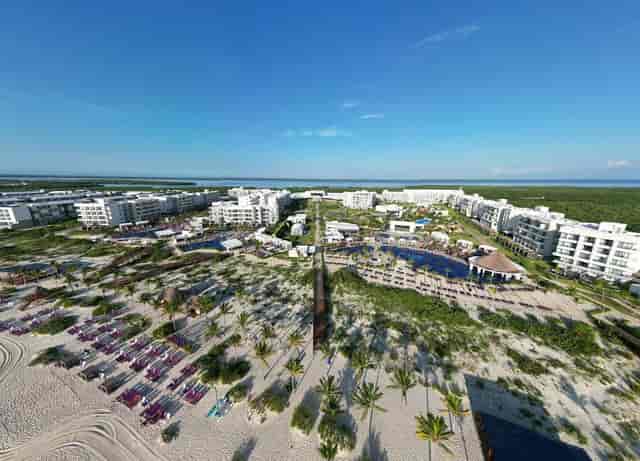 Beachfront corporate retreat at Planet Hollywood Cancun with expansive outdoor event space.