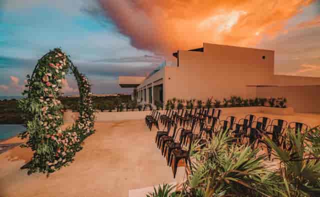 ATELIER Playa Mujeres sunset wedding ceremony on terrace, destination event venue.