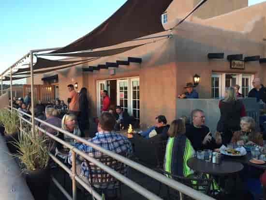 Bell Tower Bar outdoor reception area with fire features for corporate networking events.