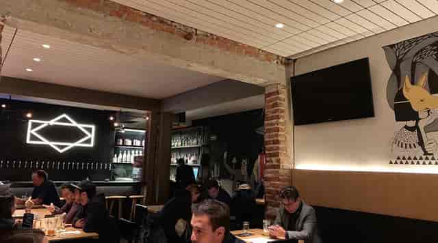 Industrial-chic restaurant bar for intimate team socials and networking events.