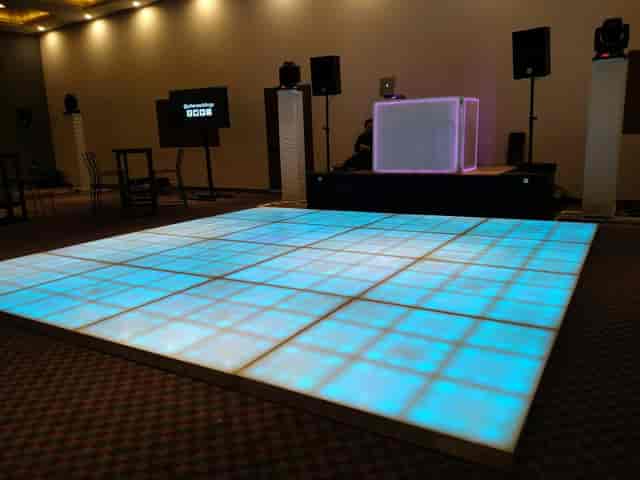 Bistro event space with LED dance floor for corporate parties and evening receptions.