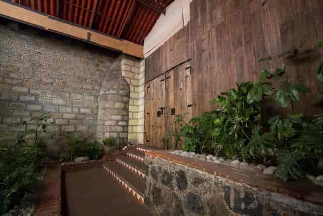 Patio Pirul venue with rustic stone and timber, perfect for atmospheric cocktail hours and dinners.