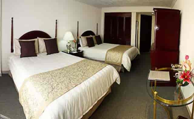 Standard double hotel room at Pedregal Palace for conference lodging and event accommodation.