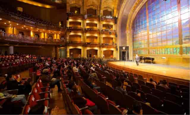 Plenary session in Palacio de Bellas Artes theater, historic venue for keynote and gala events.